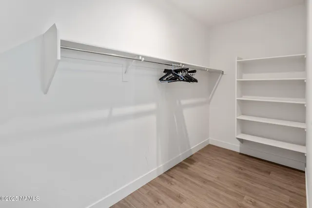 a living room filled with furniture and a large window