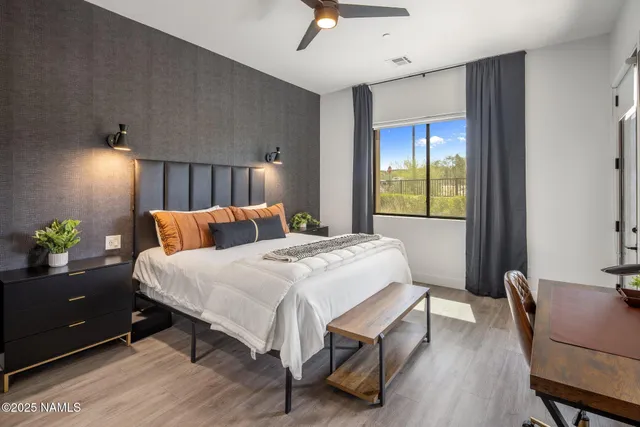 a kitchen with kitchen island a counter space a sink a stove and refrigerator