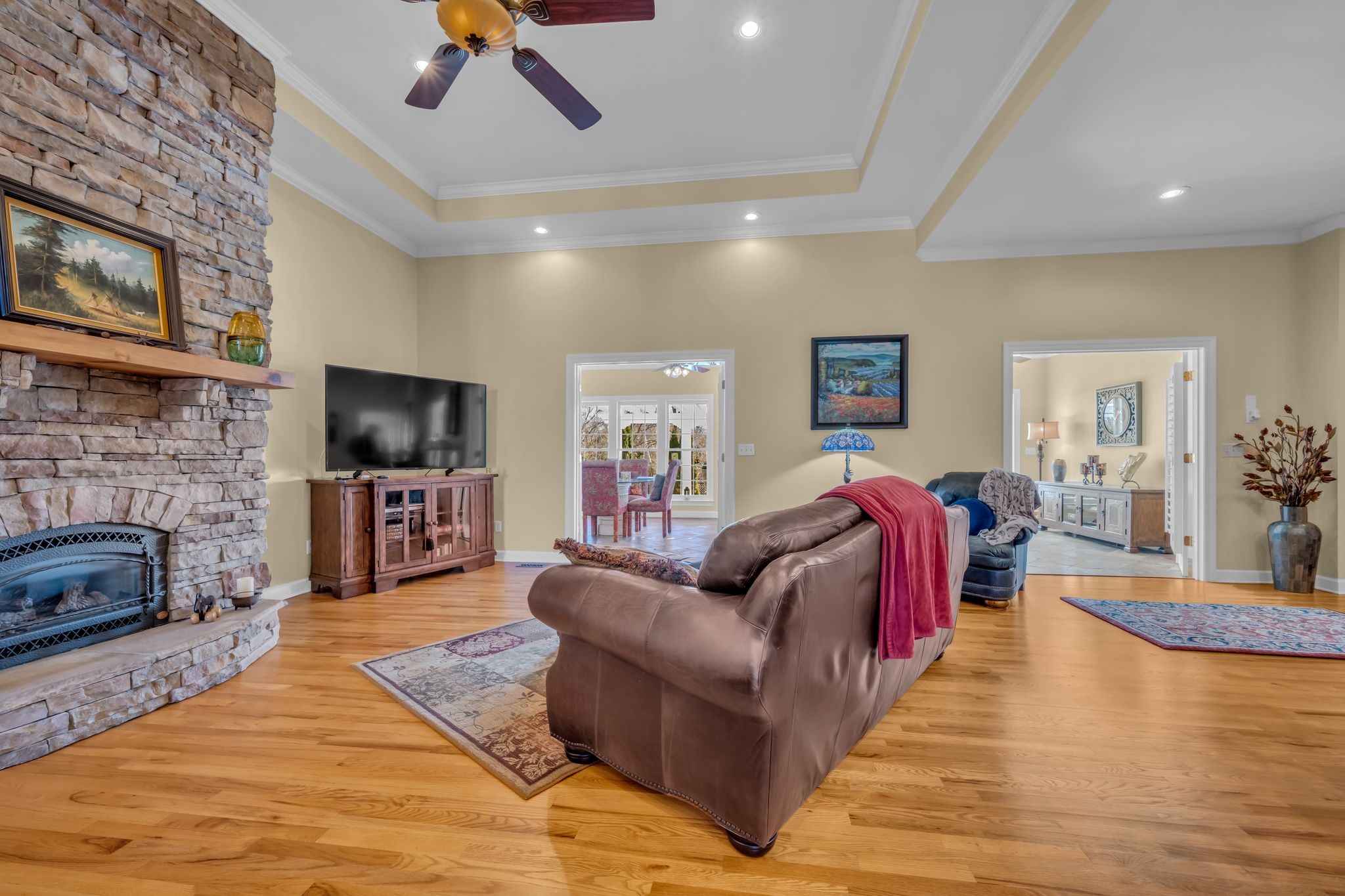 1270 Meeks Cemetery Road Burns, TN 37029 - Photo 13 of 44 a living room with fireplace furniture and a flat screen tv
