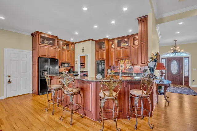 a spacious bedroom with a bed a couch and a window