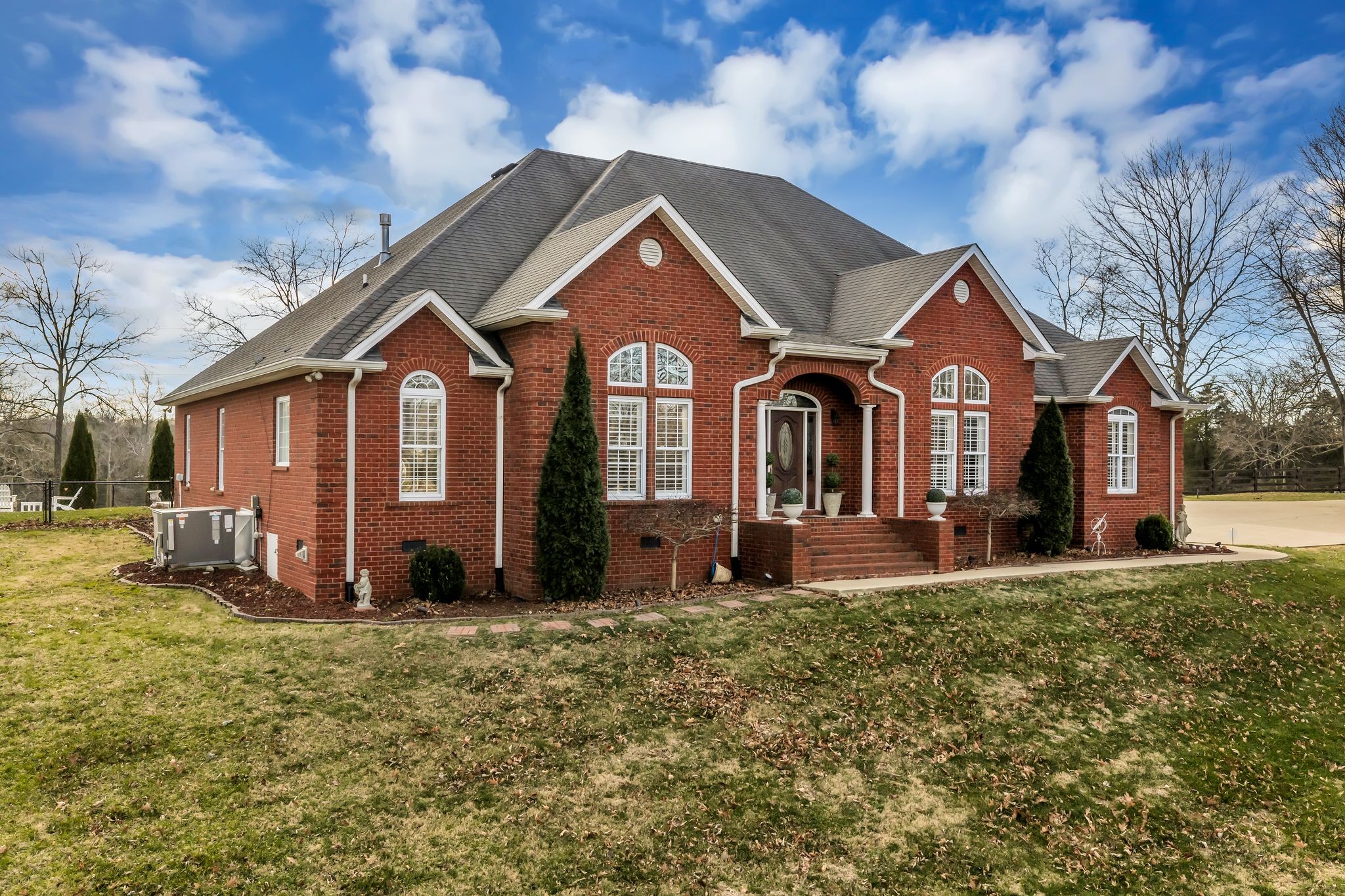 1270 Meeks Cemetery Road Burns, TN 37029 - Photo 2 of 44 a front view of a house with garden