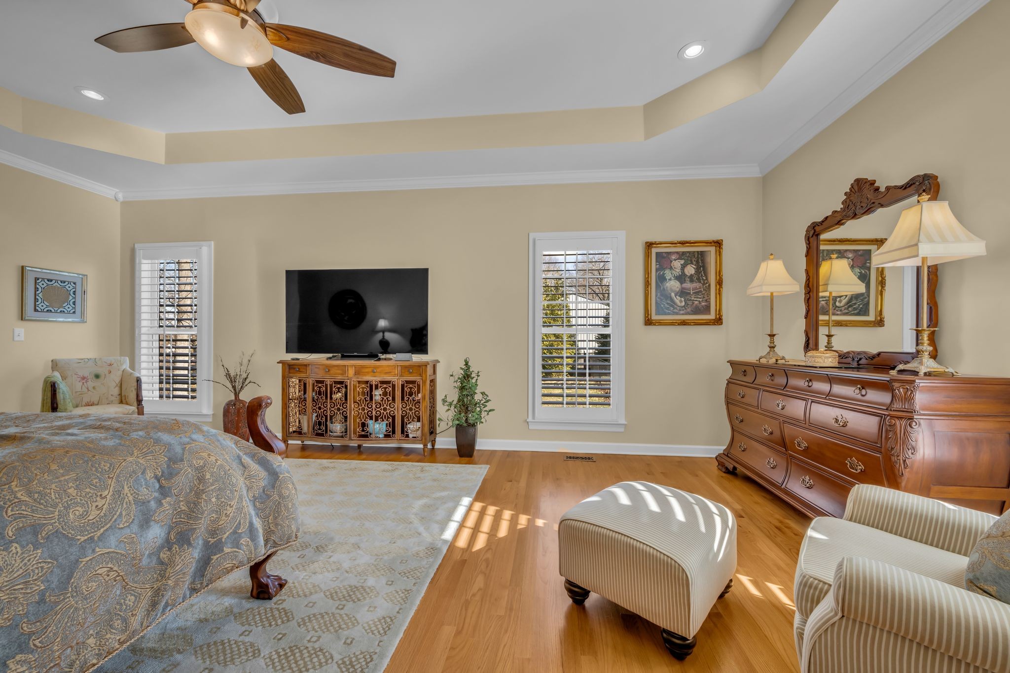 1270 Meeks Cemetery Road Burns, TN 37029 - Photo 23 of 44 a spacious bedroom with a bed a couch and a window