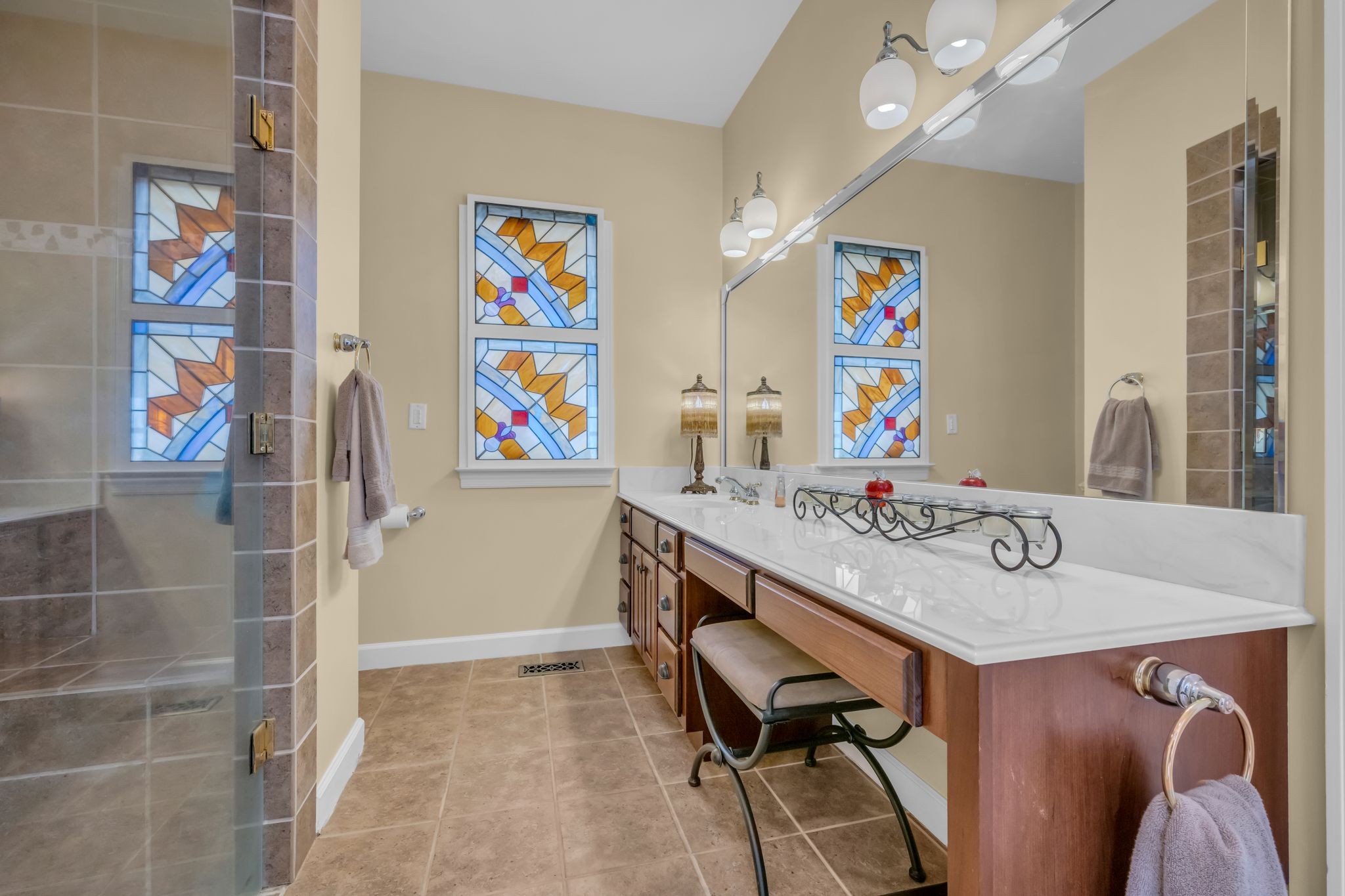 1270 Meeks Cemetery Road Burns, TN 37029 - Photo 29 of 44 a bathroom with a sink a vanity and a shower