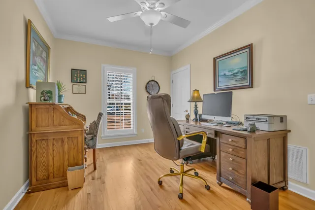 a view of a chairs and table in the backyard