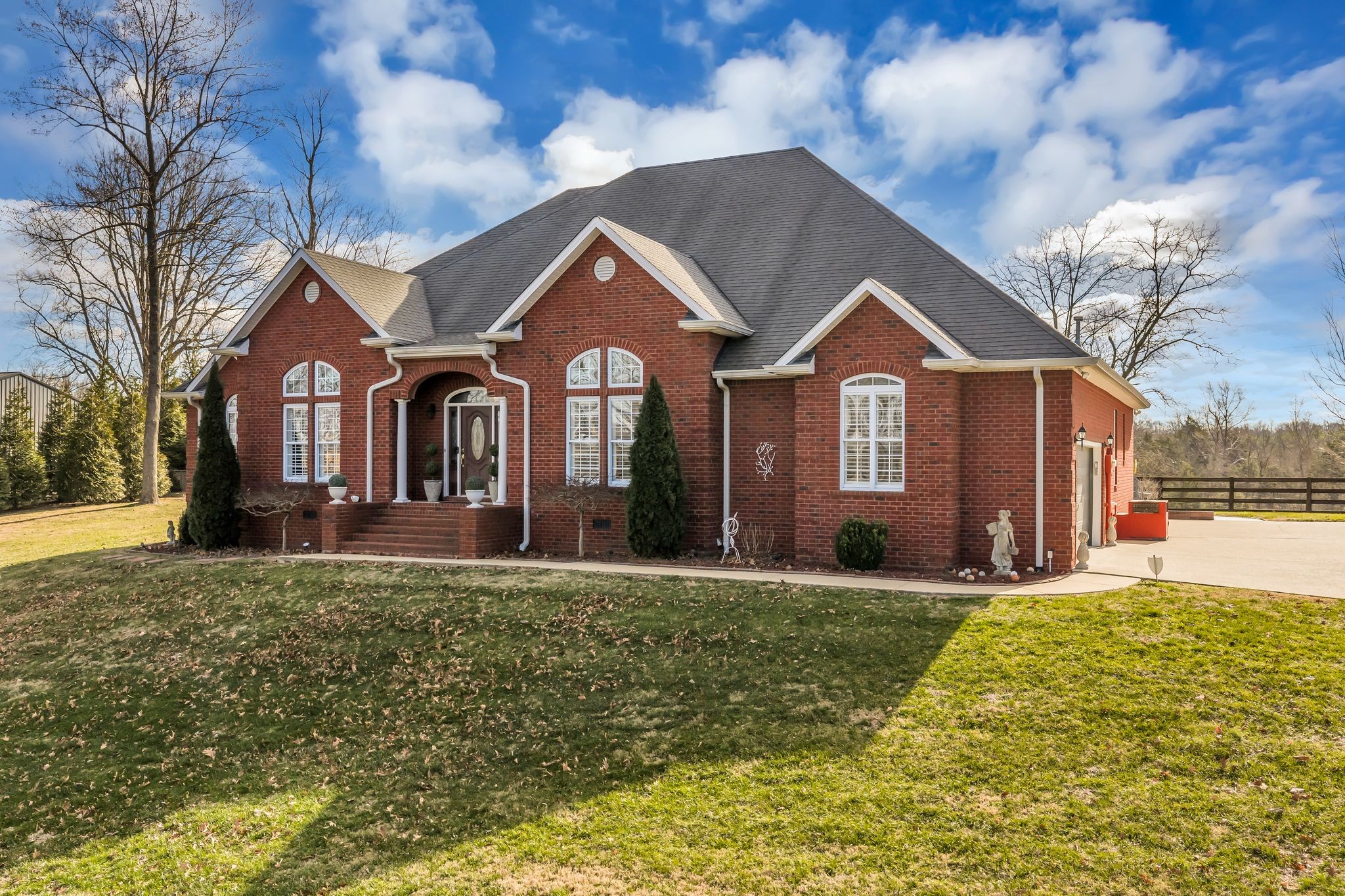 1270 Meeks Cemetery Road Burns, TN 37029 - Photo 3 of 44 a front view of a house with a yard