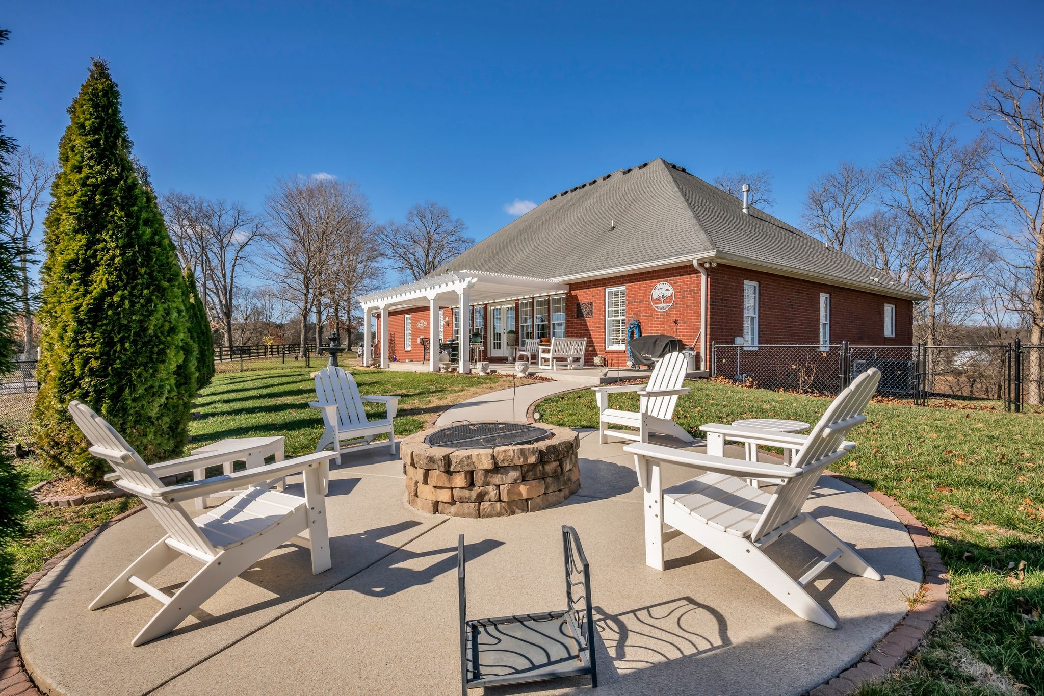 1270 Meeks Cemetery Road Burns, TN 37029 - Photo 39 of 44 a view of a patio with table and chairs with wooden floor and fence