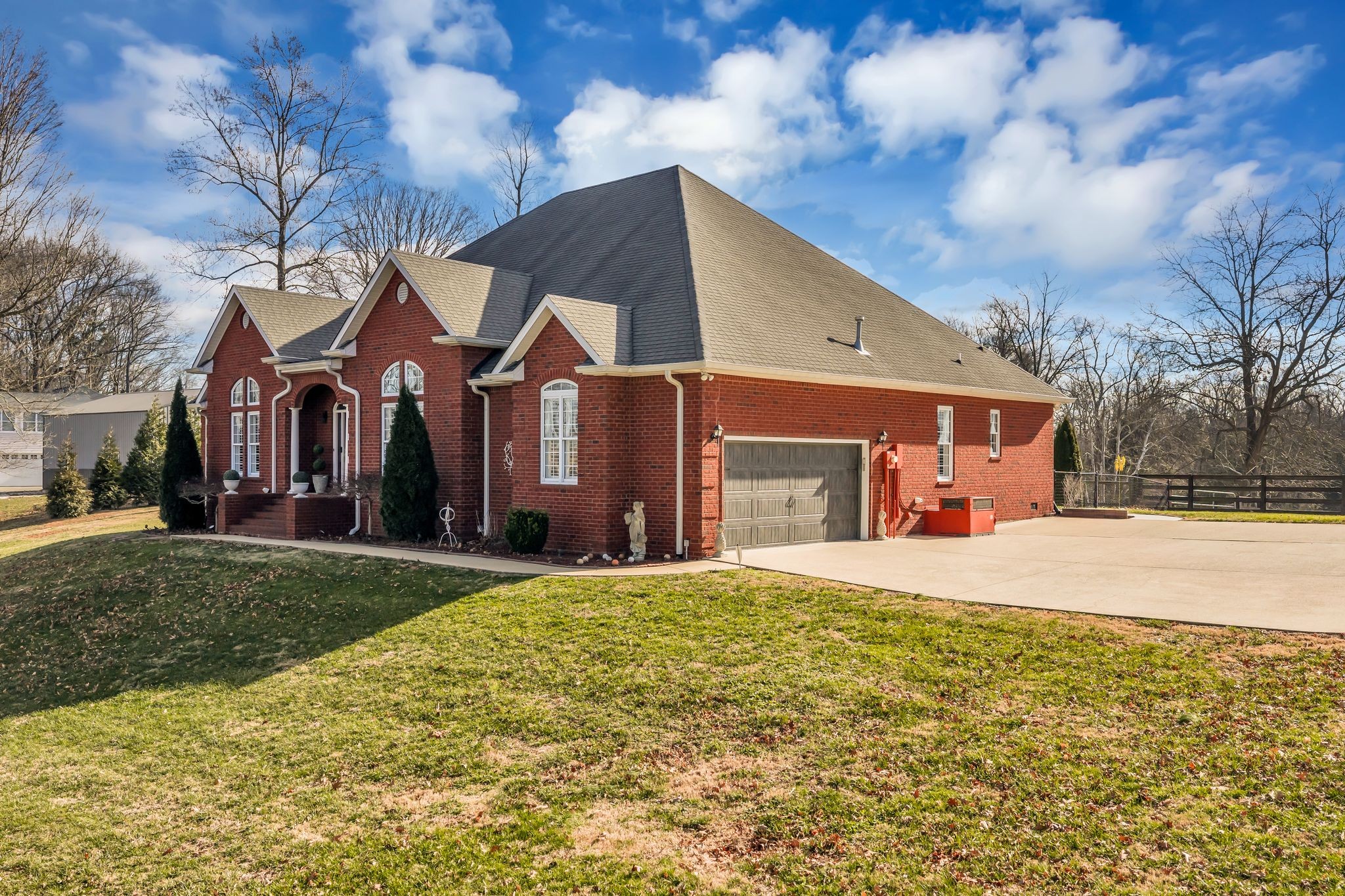 1270 Meeks Cemetery Road Burns, TN 37029 - Photo 4 of 44 a front view of a house with a yard and garage