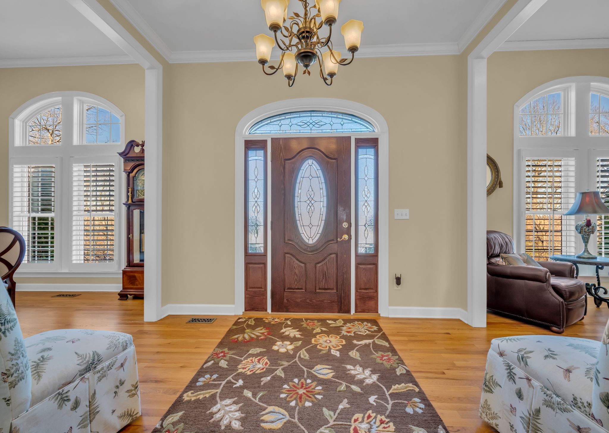 1270 Meeks Cemetery Road Burns, TN 37029 - Photo 7 of 44 a bedroom with a bed and a chandelier