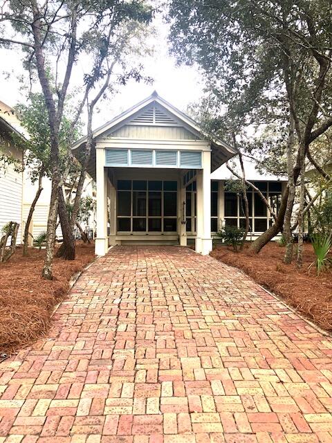 67 Mystic Cobalt Street Santa Rosa Beach, FL 32459 - Photo 2 of 2 a front view of a house with a yard