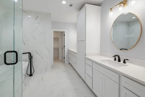 a bathroom with a sink and mirror