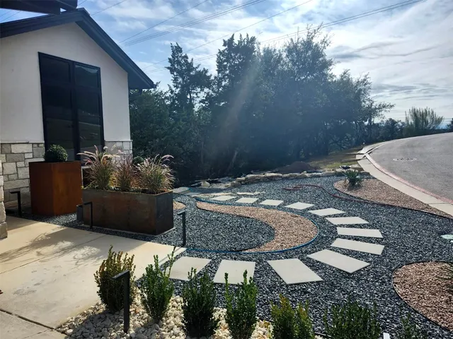 a view of a backyard with sitting area