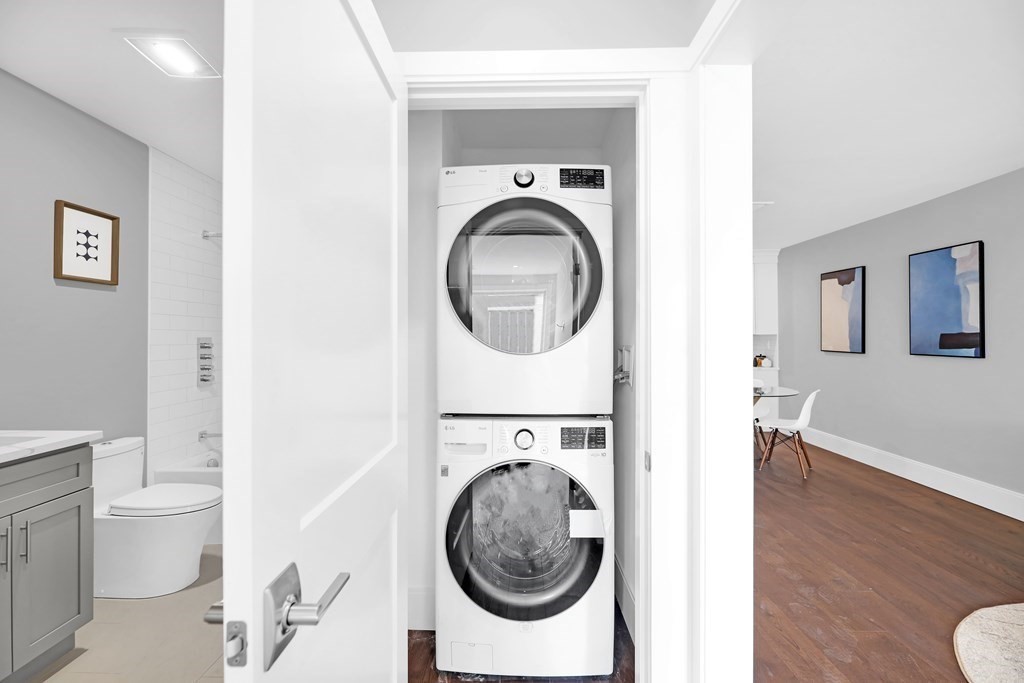 480 West Broadway, Unit 103 Boston, MA 02127 - Photo 13 of 19 a utility room with sink dryer and washer