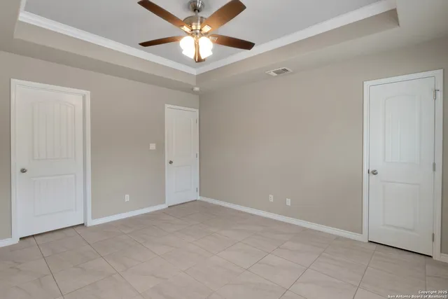 a bathroom with a granite countertop sink a toilet and a mirror