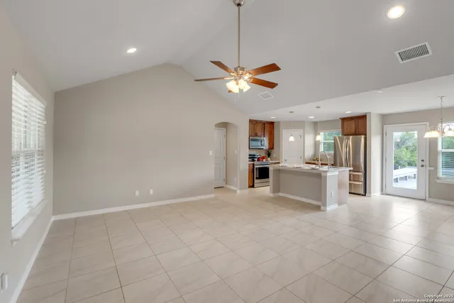 a dining room with furniture and window