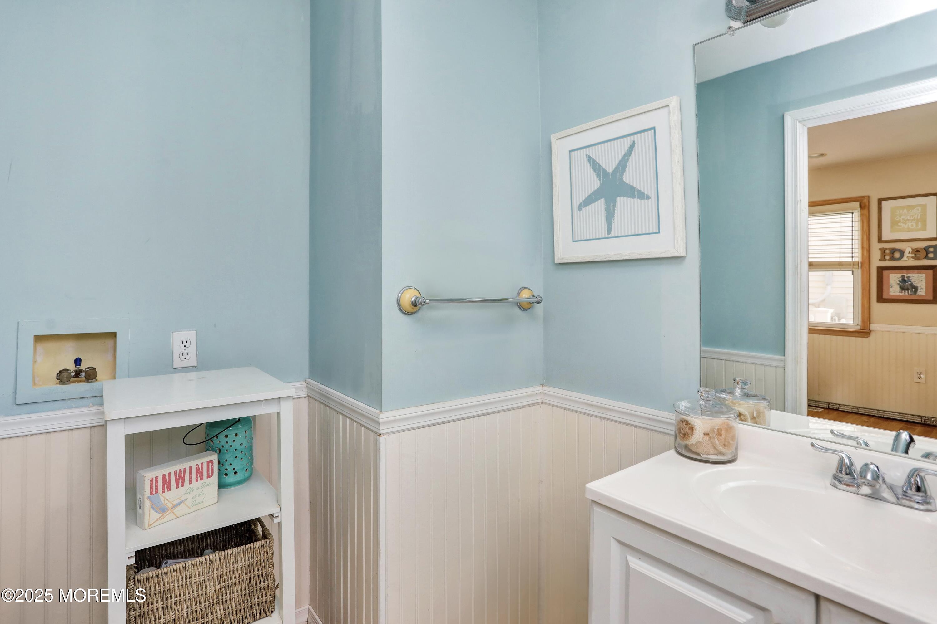 313 Shuster Avenue Seaside Heights, NJ 08751 - Photo 13 of 34 a bathroom with a sink and a mirror