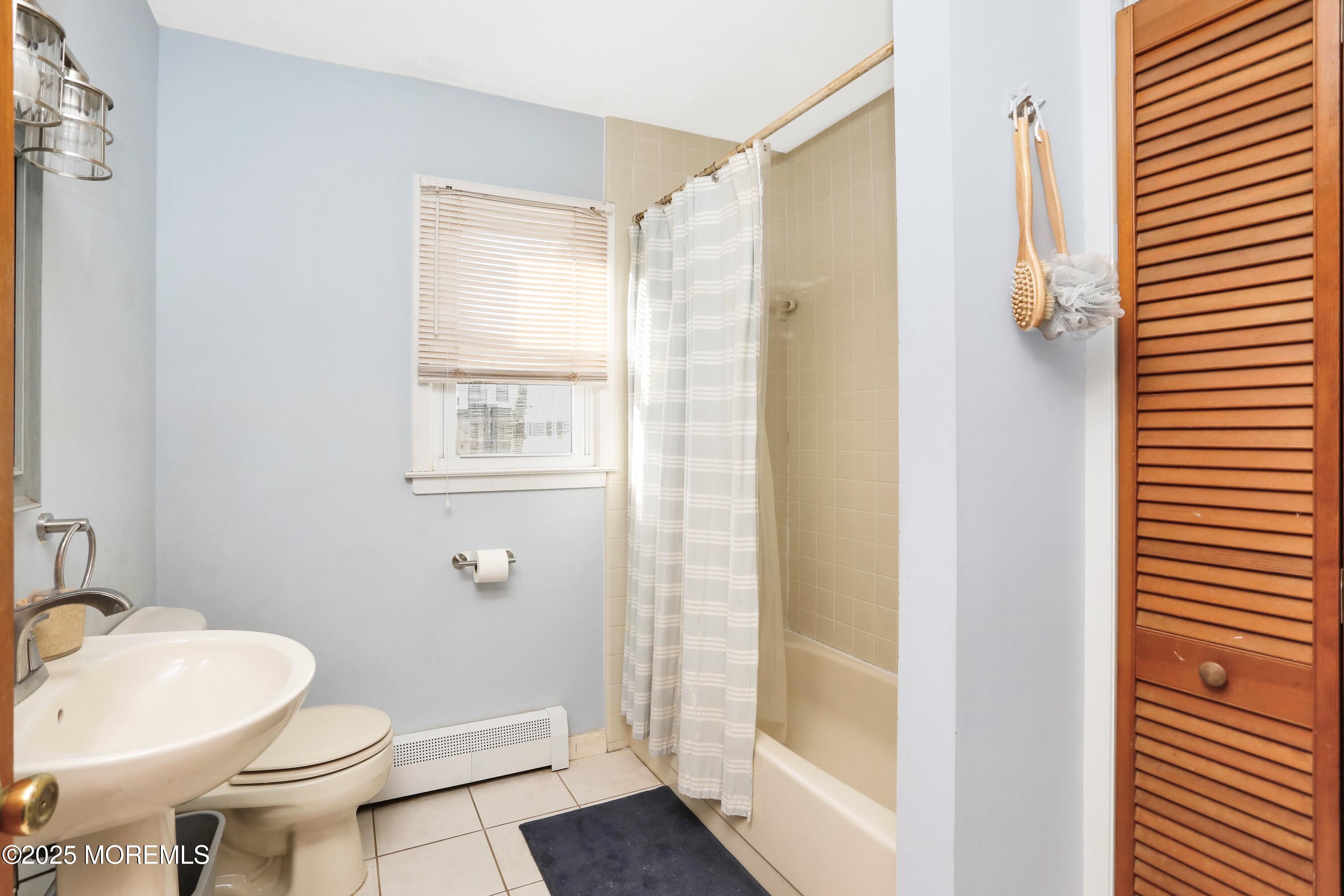 313 Shuster Avenue Seaside Heights, NJ 08751 - Photo 19 of 34 a bathroom with a sink toilet and shower