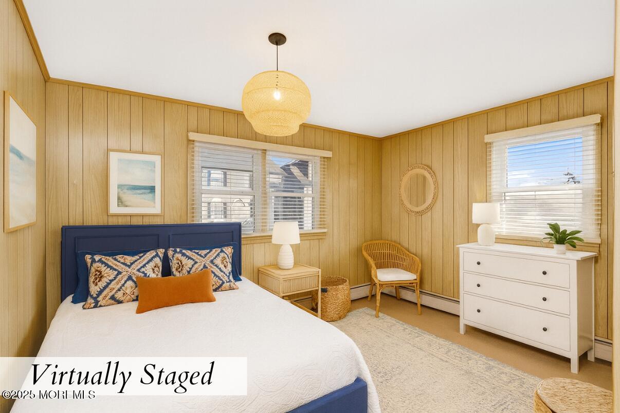 313 Shuster Avenue Seaside Heights, NJ 08751 - Photo 21 of 34 a bedroom with a bed and wooden floor