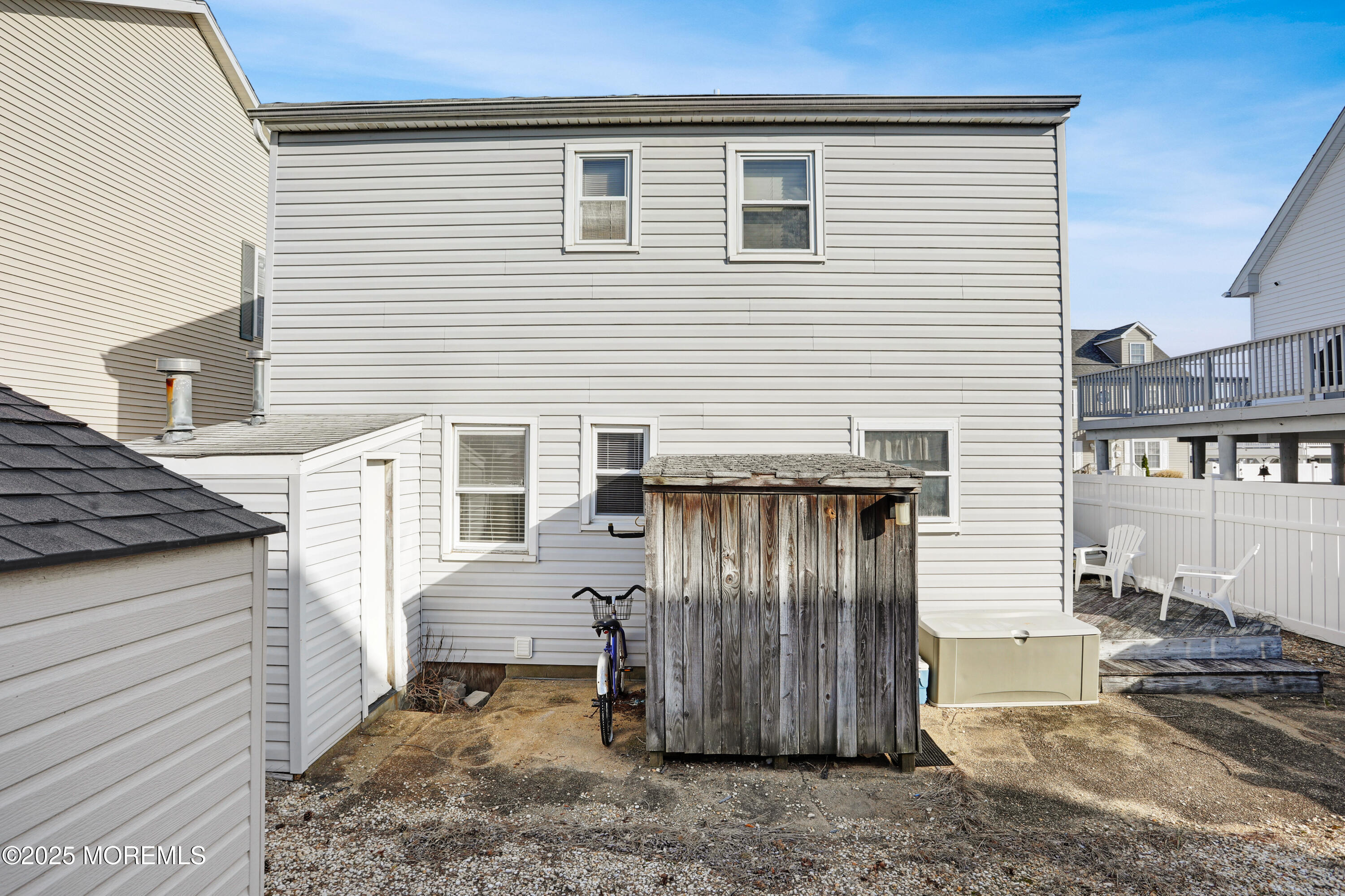 313 Shuster Avenue Seaside Heights, NJ 08751 - Photo 24 of 34 a view of a house with a door and wooden walls