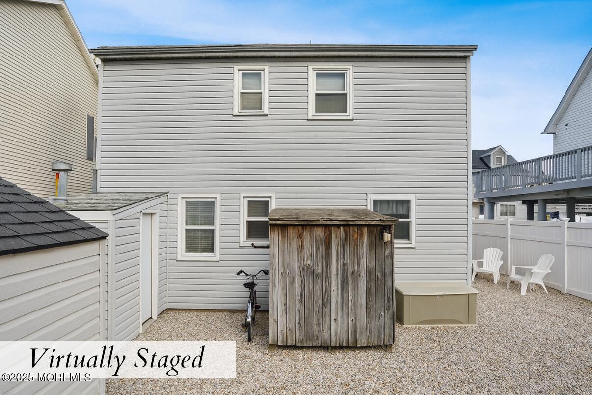 313 Shuster Avenue Seaside Heights, NJ 08751 - Photo 25 of 34 a view of a house with wooden fence