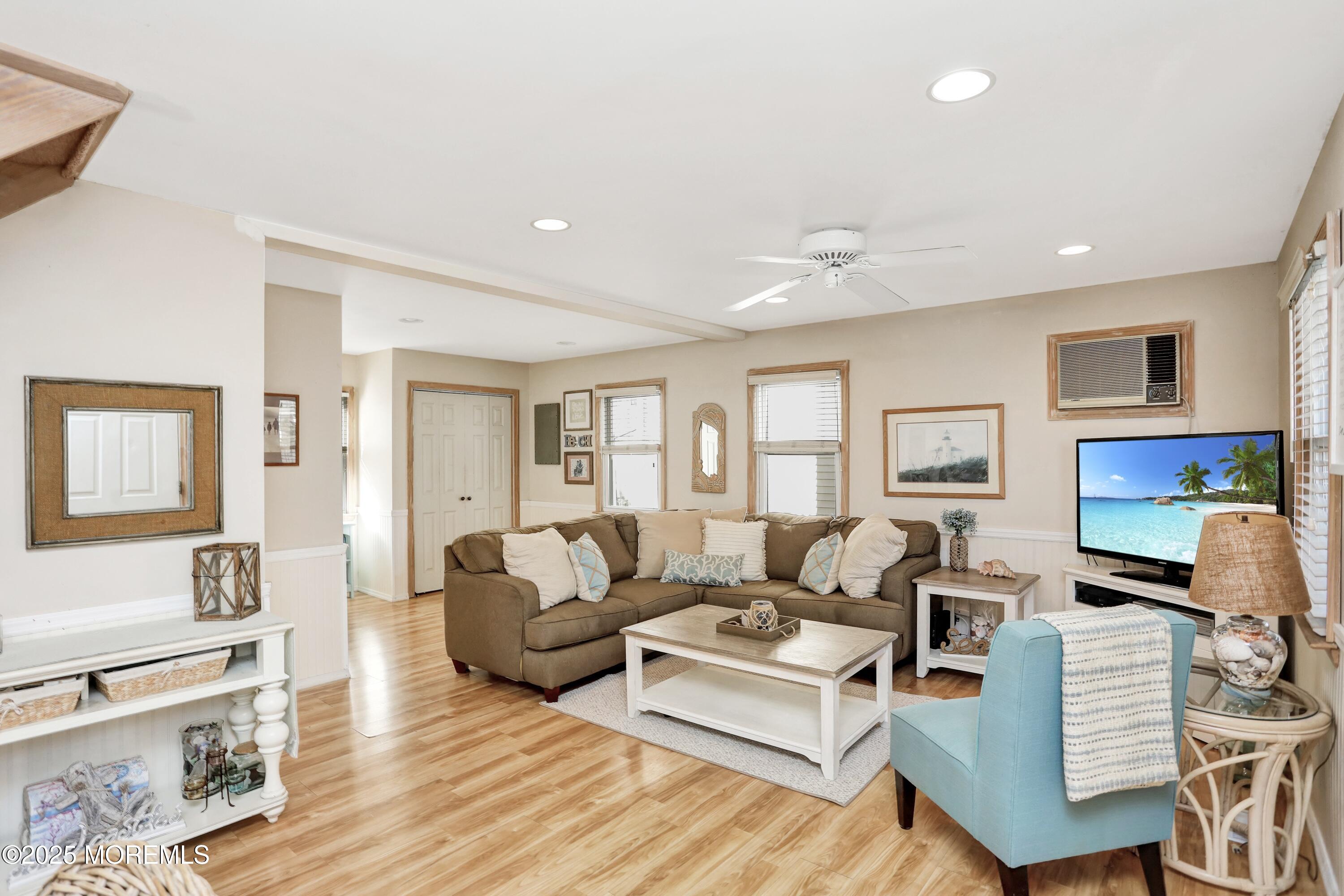 313 Shuster Avenue Seaside Heights, NJ 08751 - Photo 5 of 34 a living room with furniture and a wooden floor