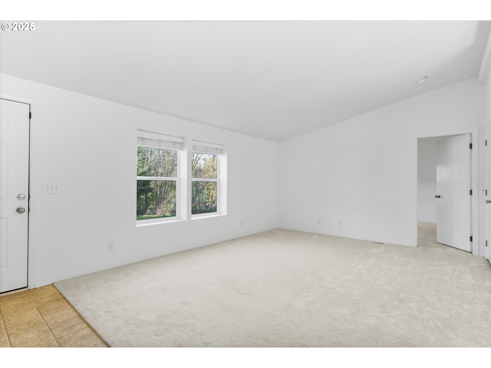 13996 Holcomb Boulevard Oregon City, OR 97045 - Photo 13 of 42 a view of an empty room with a window