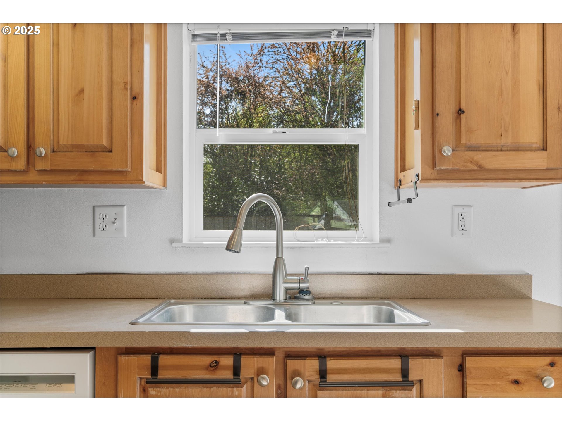 13996 Holcomb Boulevard Oregon City, OR 97045 - Photo 19 of 42 a kitchen with granite countertop a sink and a window
