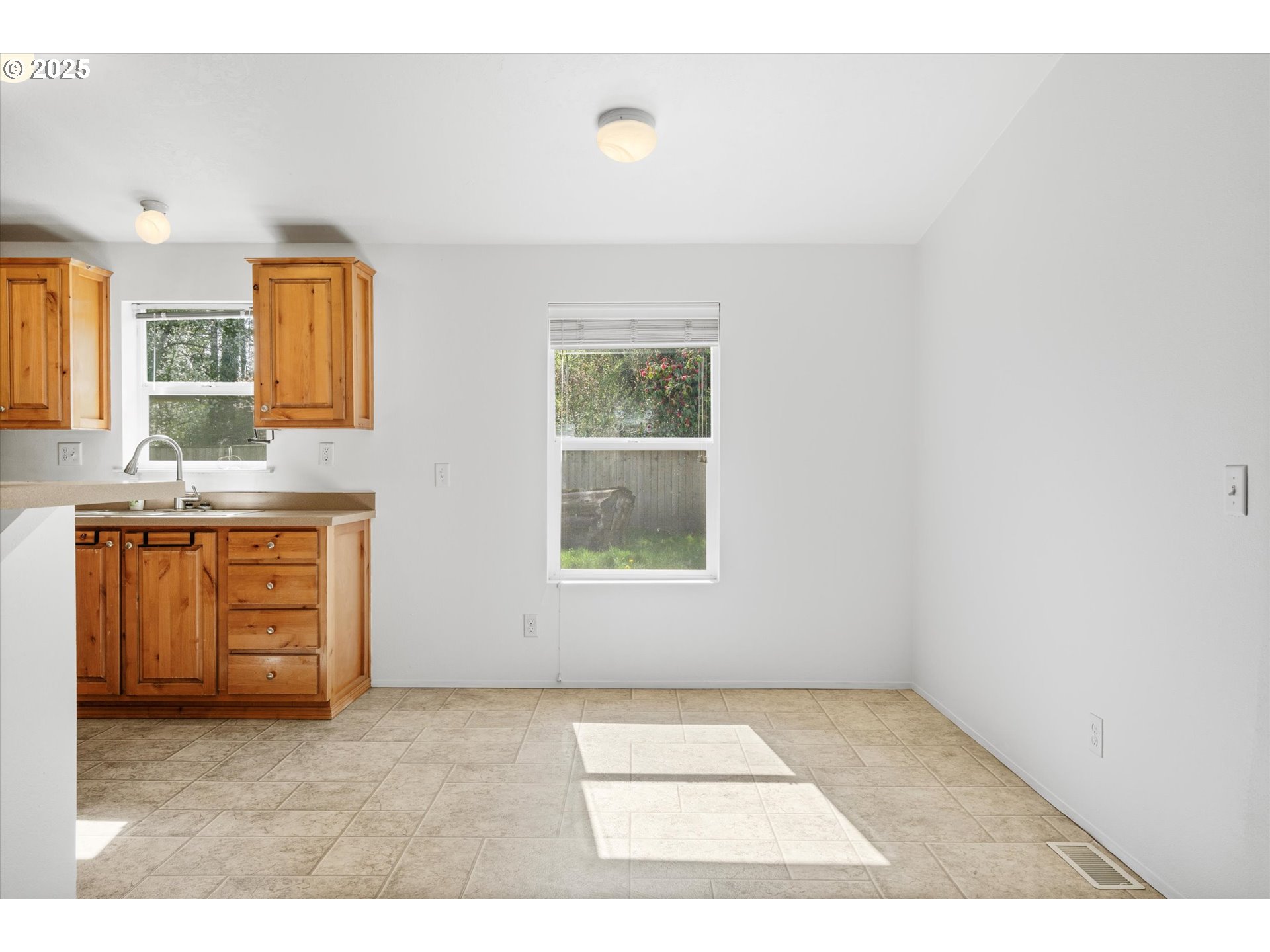 13996 Holcomb Boulevard Oregon City, OR 97045 - Photo 20 of 42 a view of kitchen with granite countertop cabinets and window
