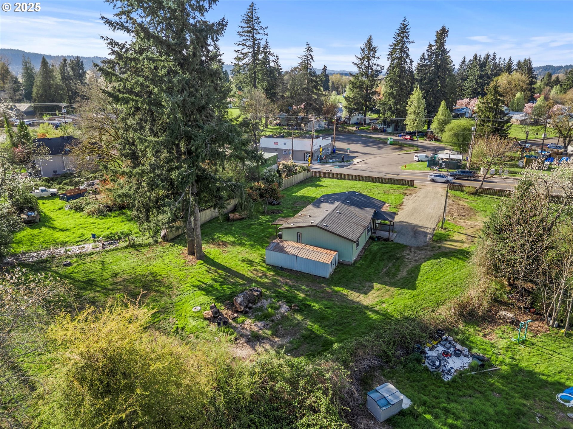 13996 Holcomb Boulevard Oregon City, OR 97045 - Photo 36 of 42 a view of a swimming pool with a yard and a fountain