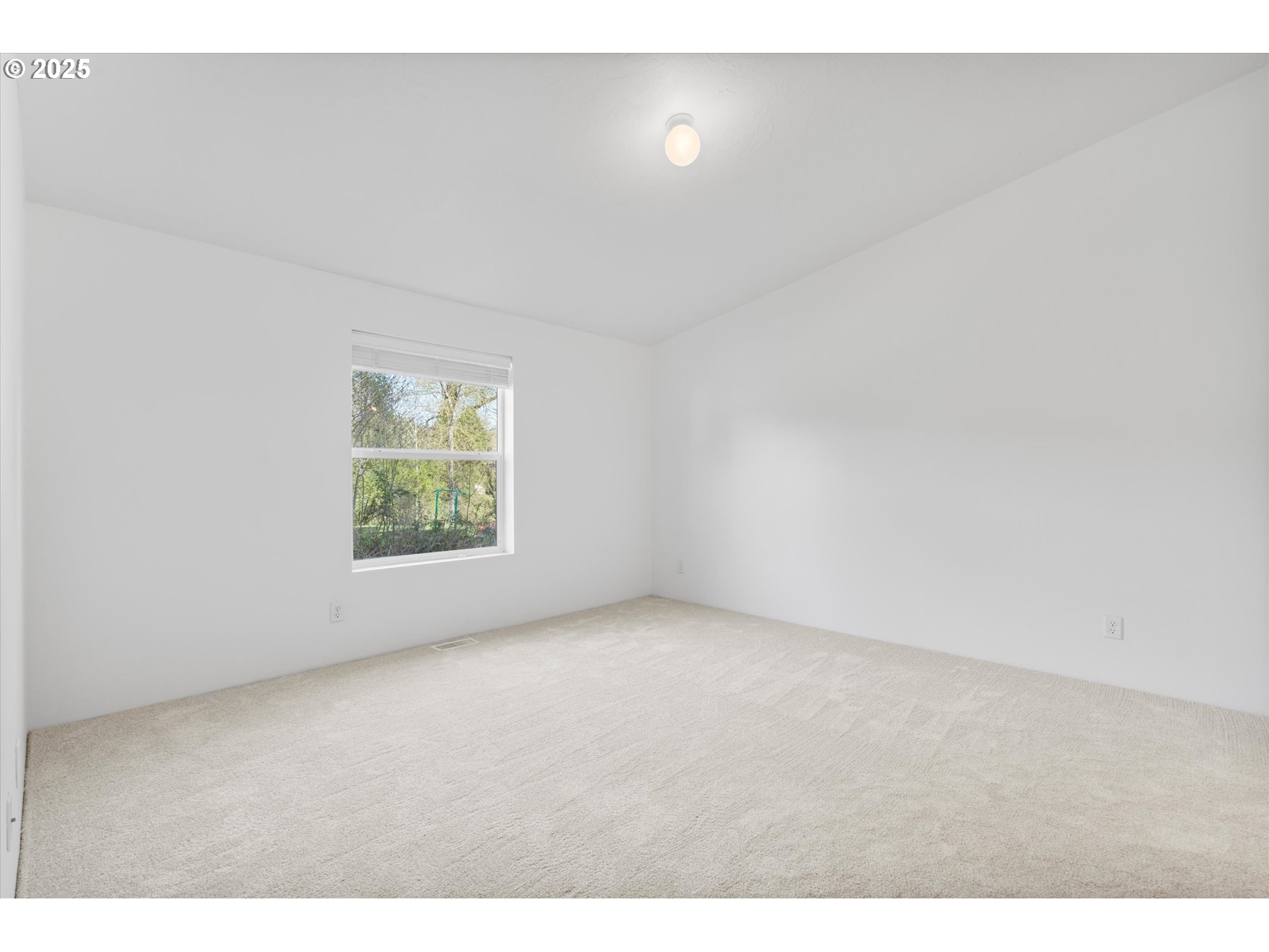 13996 Holcomb Boulevard Oregon City, OR 97045 - Photo 6 of 42 a view of an empty room with a window