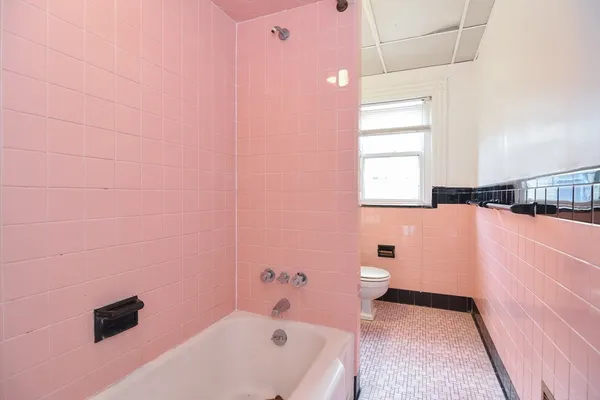 a bathroom with a bathtub sink and toilet