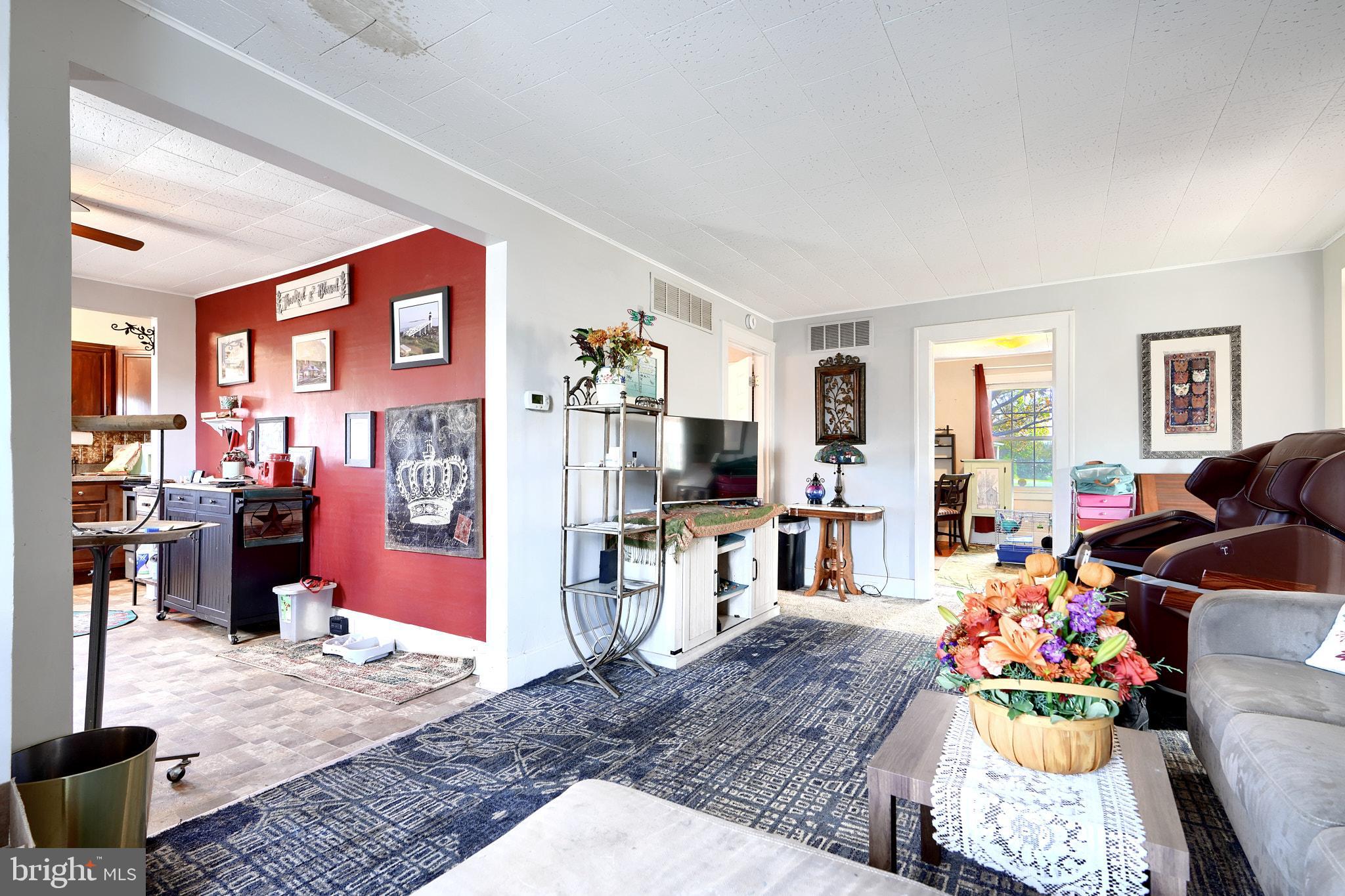 10816 Red Lion Road White Marsh, MD 21162 - Photo 11 of 39 a living room with furniture and a table
