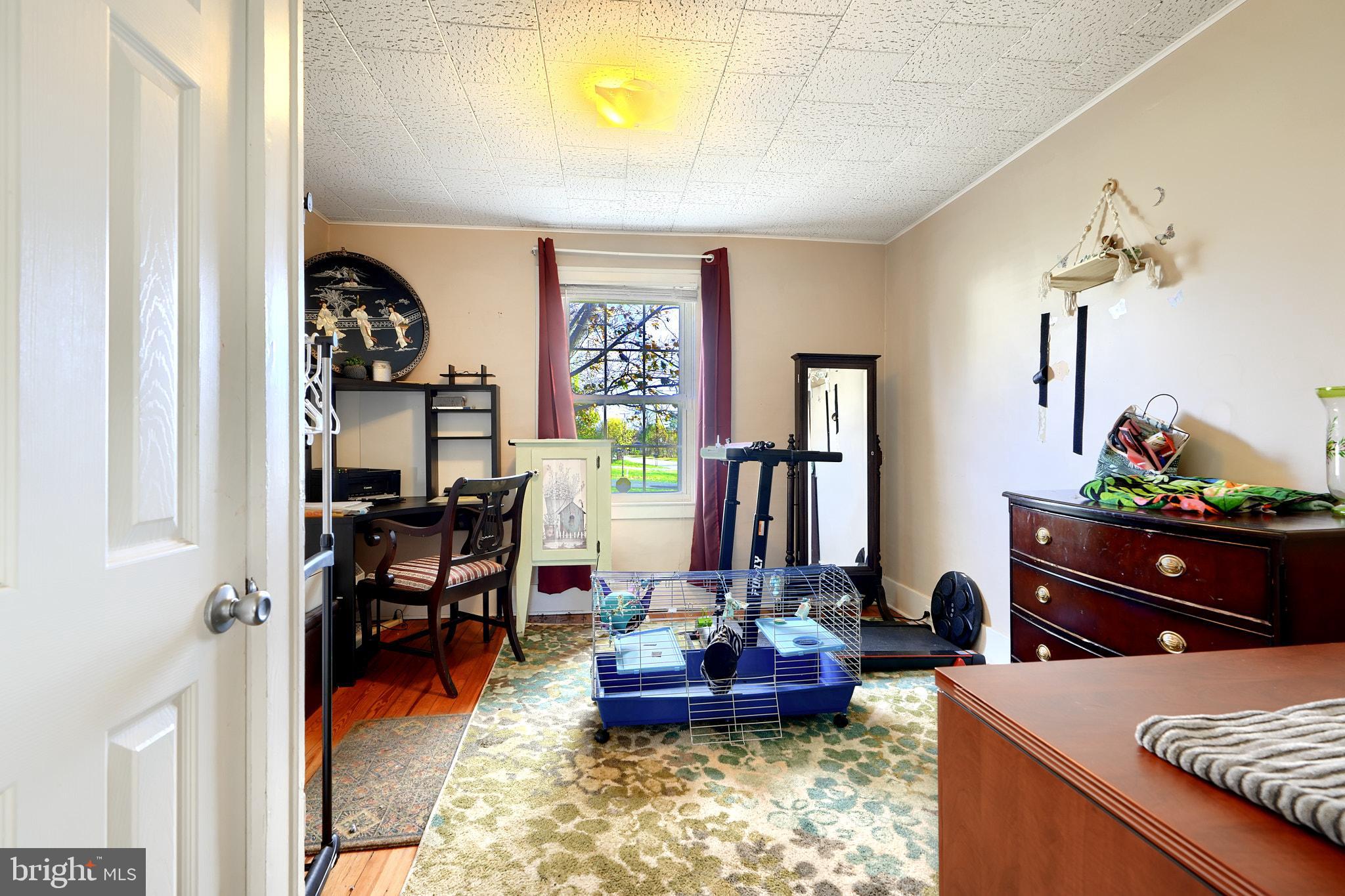 10816 Red Lion Road White Marsh, MD 21162 - Photo 17 of 39 a living room with furniture and a table