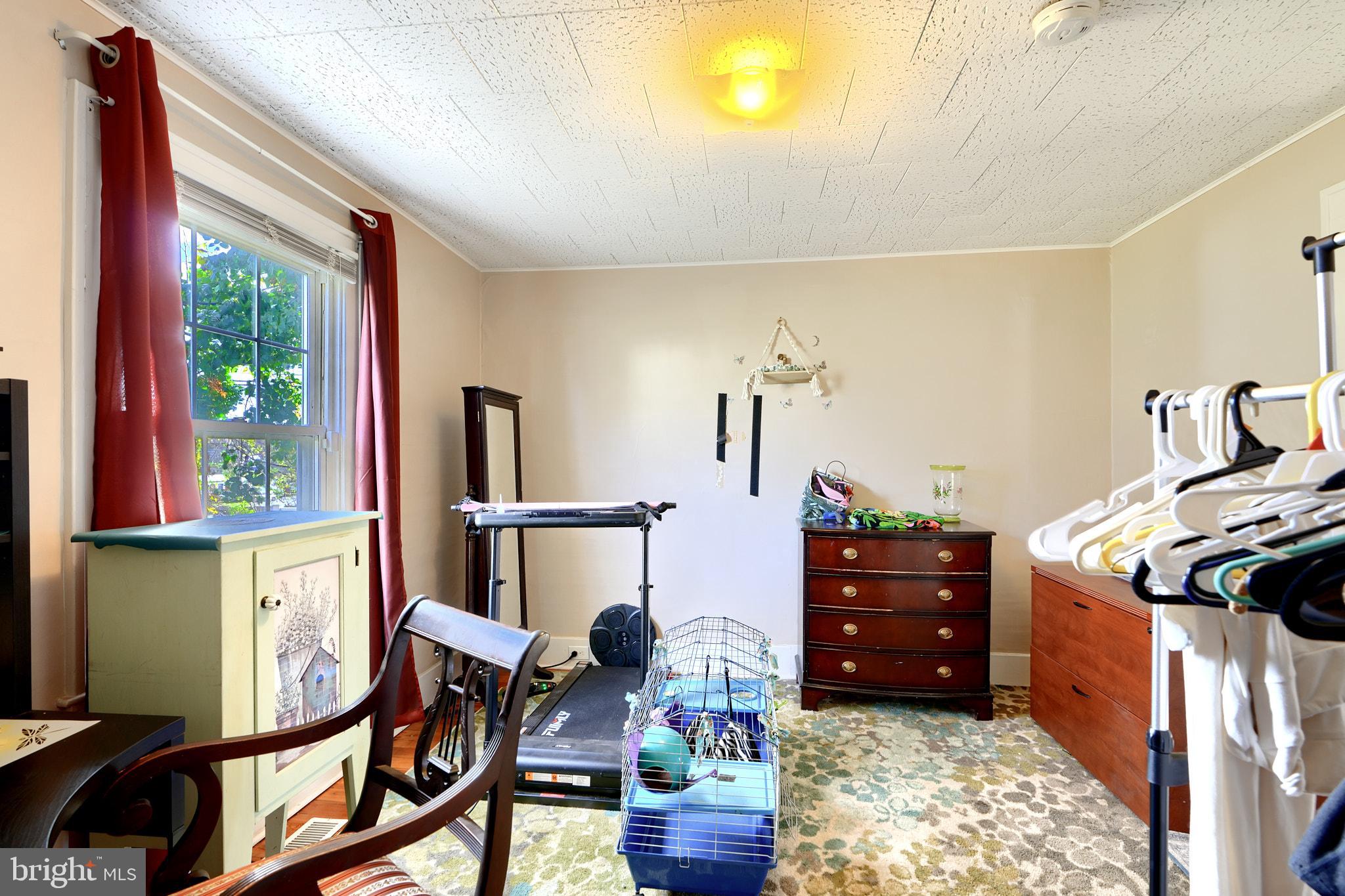 10816 Red Lion Road White Marsh, MD 21162 - Photo 18 of 39 a bedroom with furniture and a window