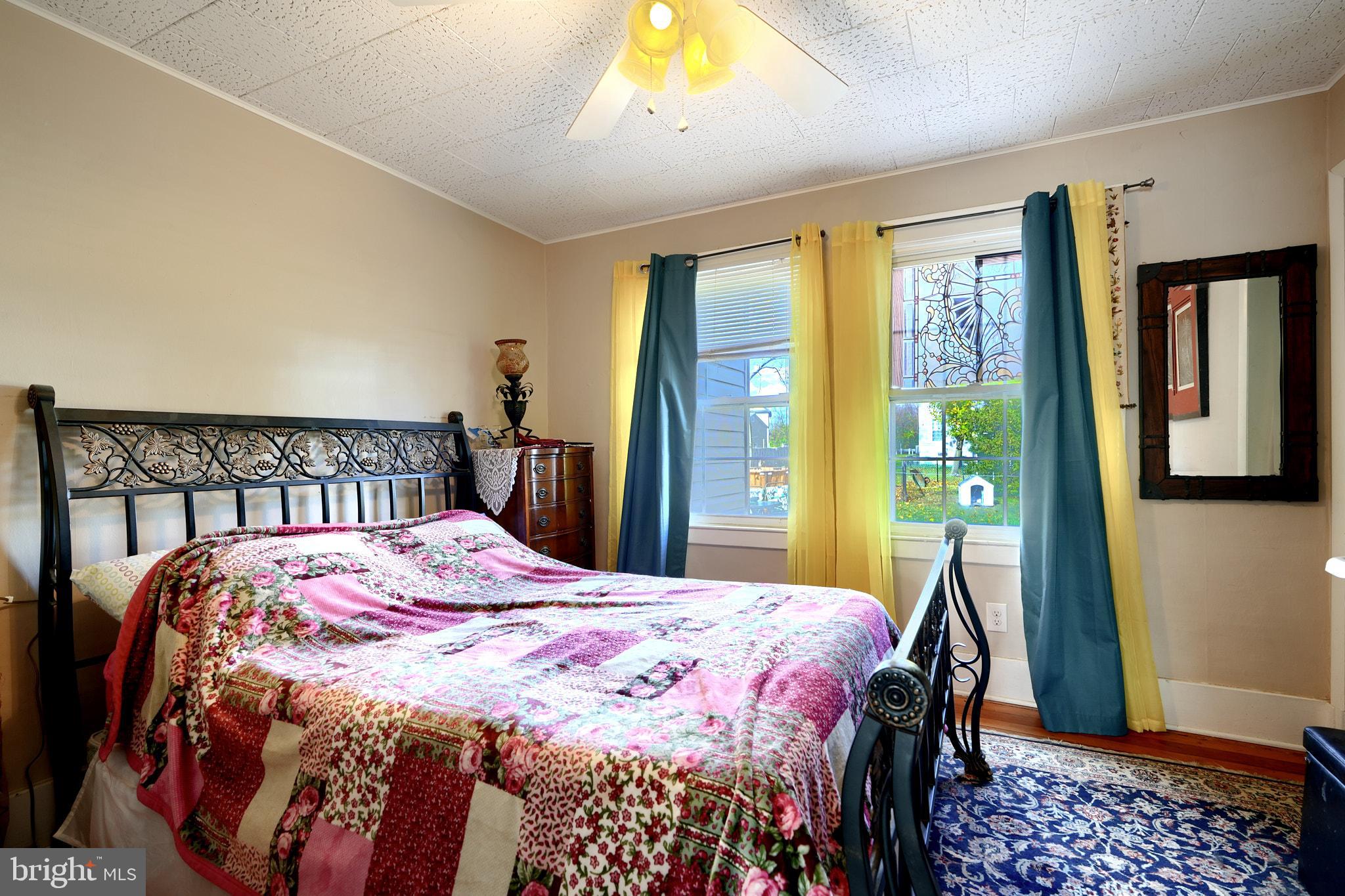 10816 Red Lion Road White Marsh, MD 21162 - Photo 21 of 39 a bedroom with a bed and a dresser
