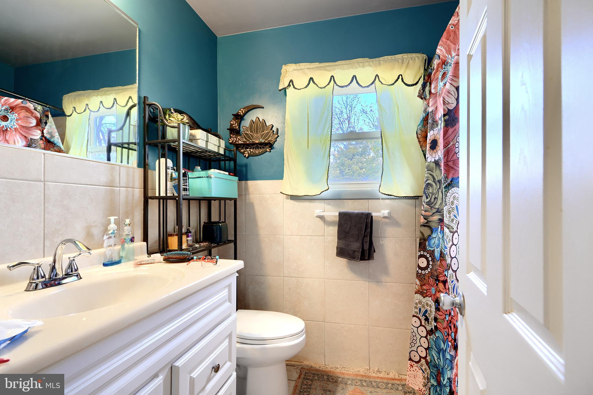 10816 Red Lion Road White Marsh, MD 21162 - Photo 24 of 39 a bathroom with a sink toilet and mirror