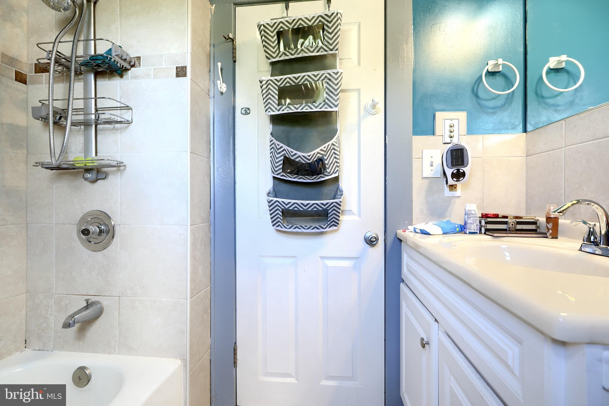 10816 Red Lion Road White Marsh, MD 21162 - Photo 27 of 39 a bathroom with a sink and a mirror