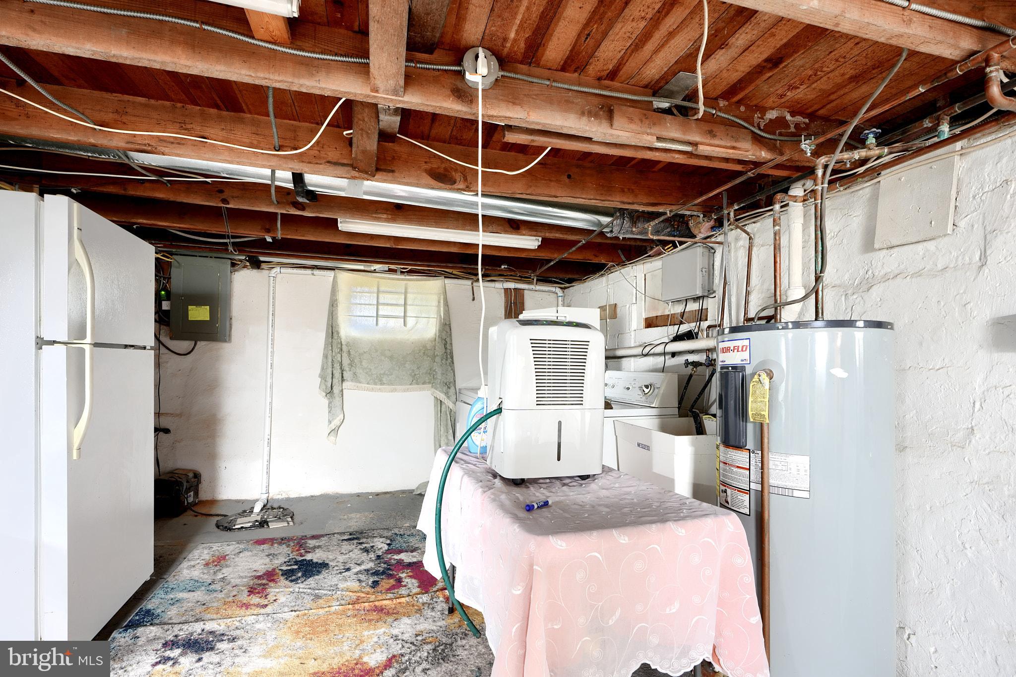 10816 Red Lion Road White Marsh, MD 21162 - Photo 29 of 39 a bed room with a bed and a refrigerator