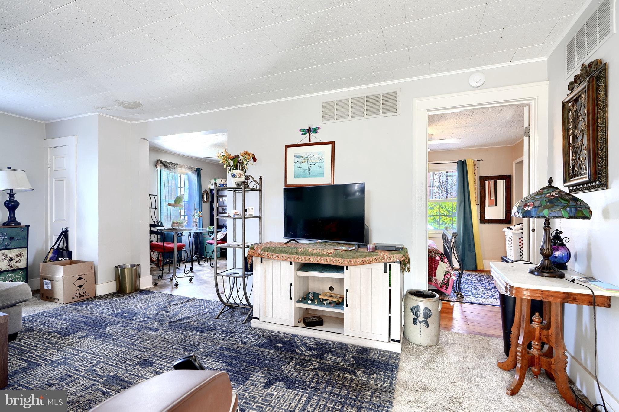 10816 Red Lion Road White Marsh, MD 21162 - Photo 8 of 39 a living room with furniture and a flat screen tv