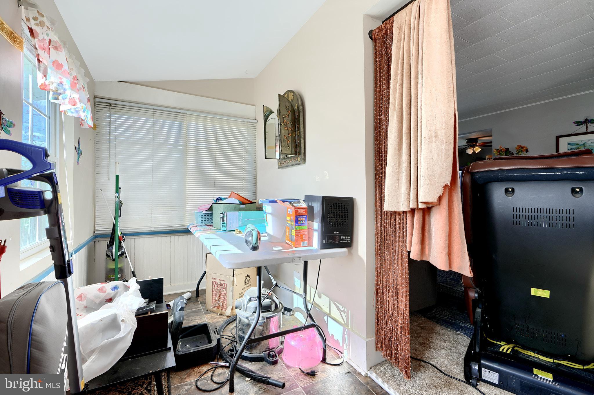 10816 Red Lion Road White Marsh, MD 21162 - Photo 9 of 39 a room with furniture a rug and a window