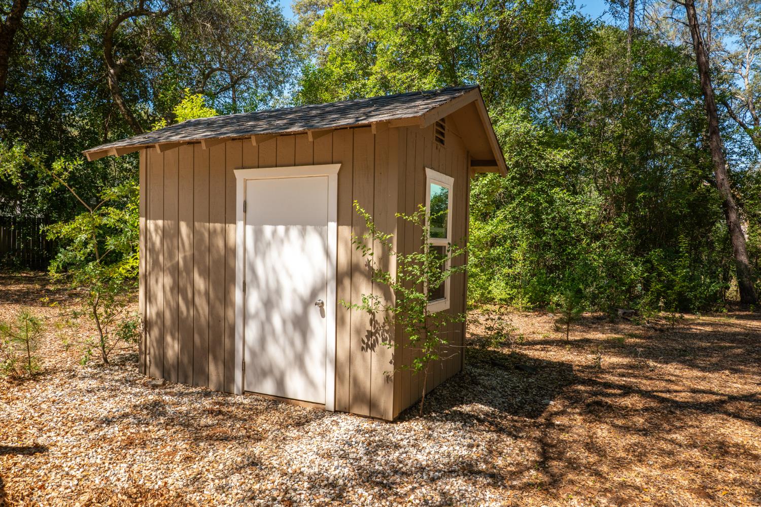 10875 Spenceville Road Penn Valley, CA 95946 - Photo 43 of 49 a view of a wooden house with a large tree
