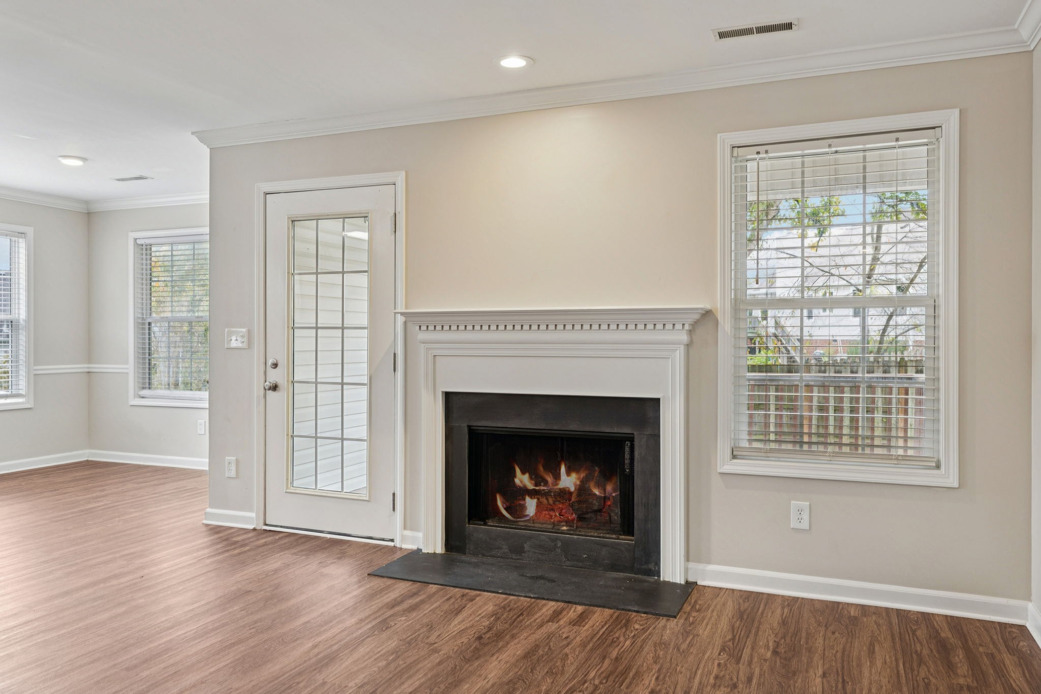 1305 Chapman Court Spring Hill, TN 37174 - Photo 11 of 53 a view of an empty room with wooden floor and a window