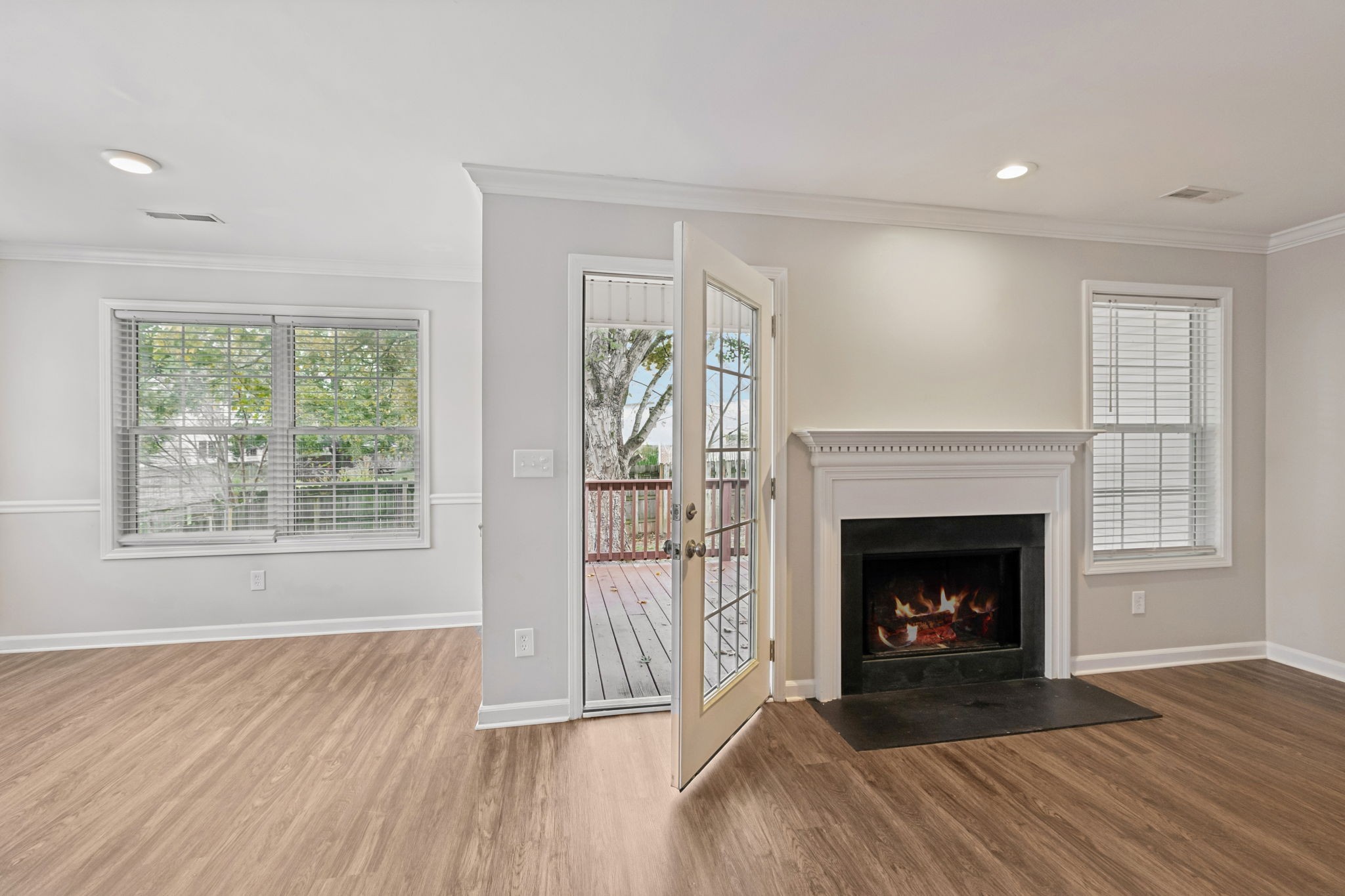 1305 Chapman Court Spring Hill, TN 37174 - Photo 13 of 53 a living room with fireplace and wooden floor