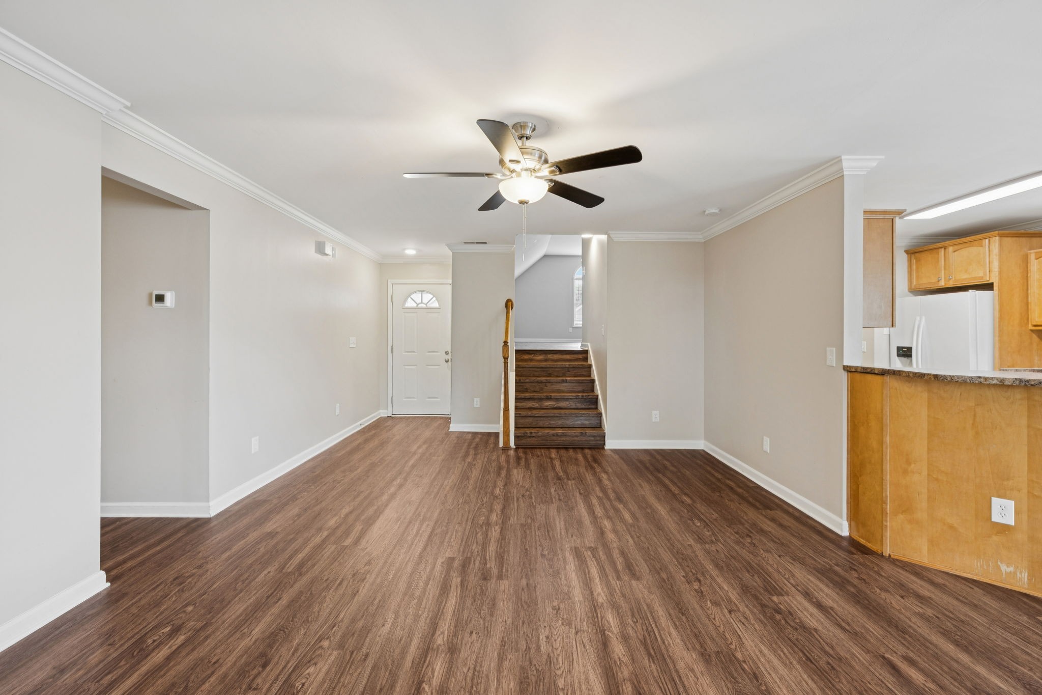 1305 Chapman Court Spring Hill, TN 37174 - Photo 15 of 53 an empty room with wooden floor and a ceiling fan