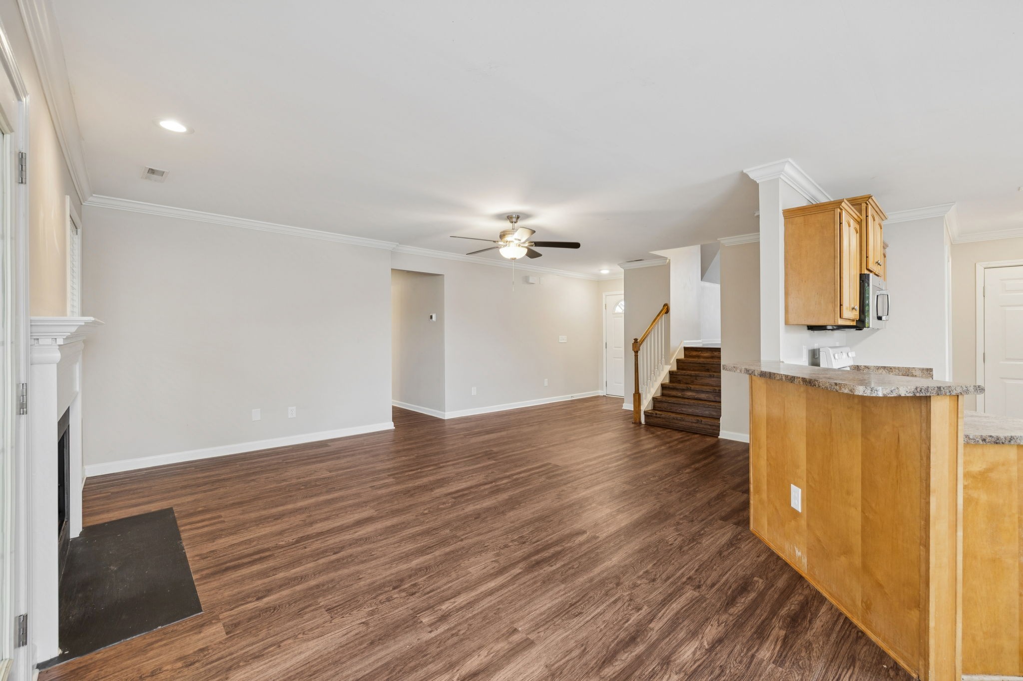 1305 Chapman Court Spring Hill, TN 37174 - Photo 16 of 53 a view of a kitchen with wooden floor and a sink