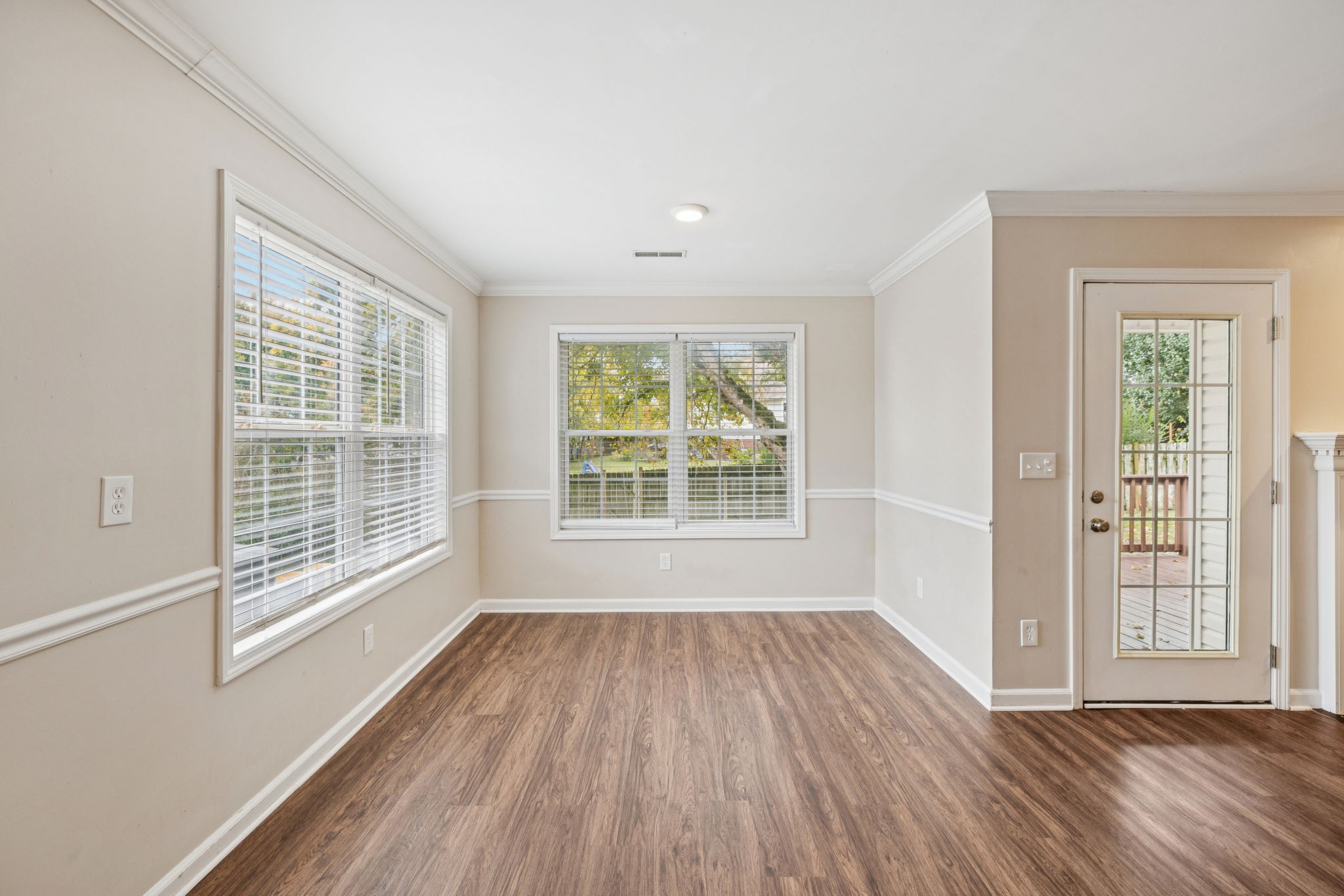1305 Chapman Court Spring Hill, TN 37174 - Photo 19 of 53 a view of an empty room with glass window and hardwood floor