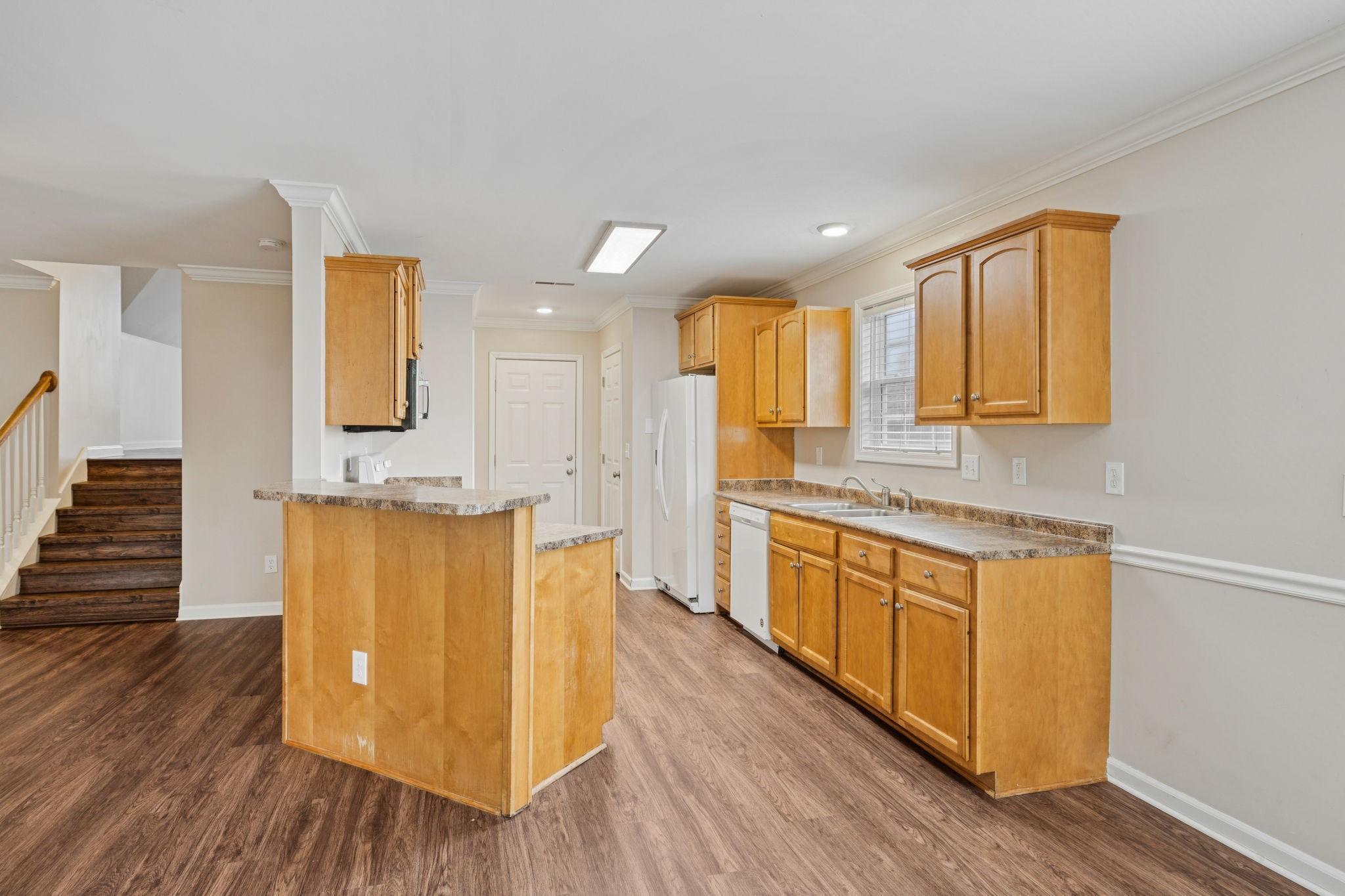 1305 Chapman Court Spring Hill, TN 37174 - Photo 20 of 53 a bathroom with a granite countertop sink a mirror and a bathtub