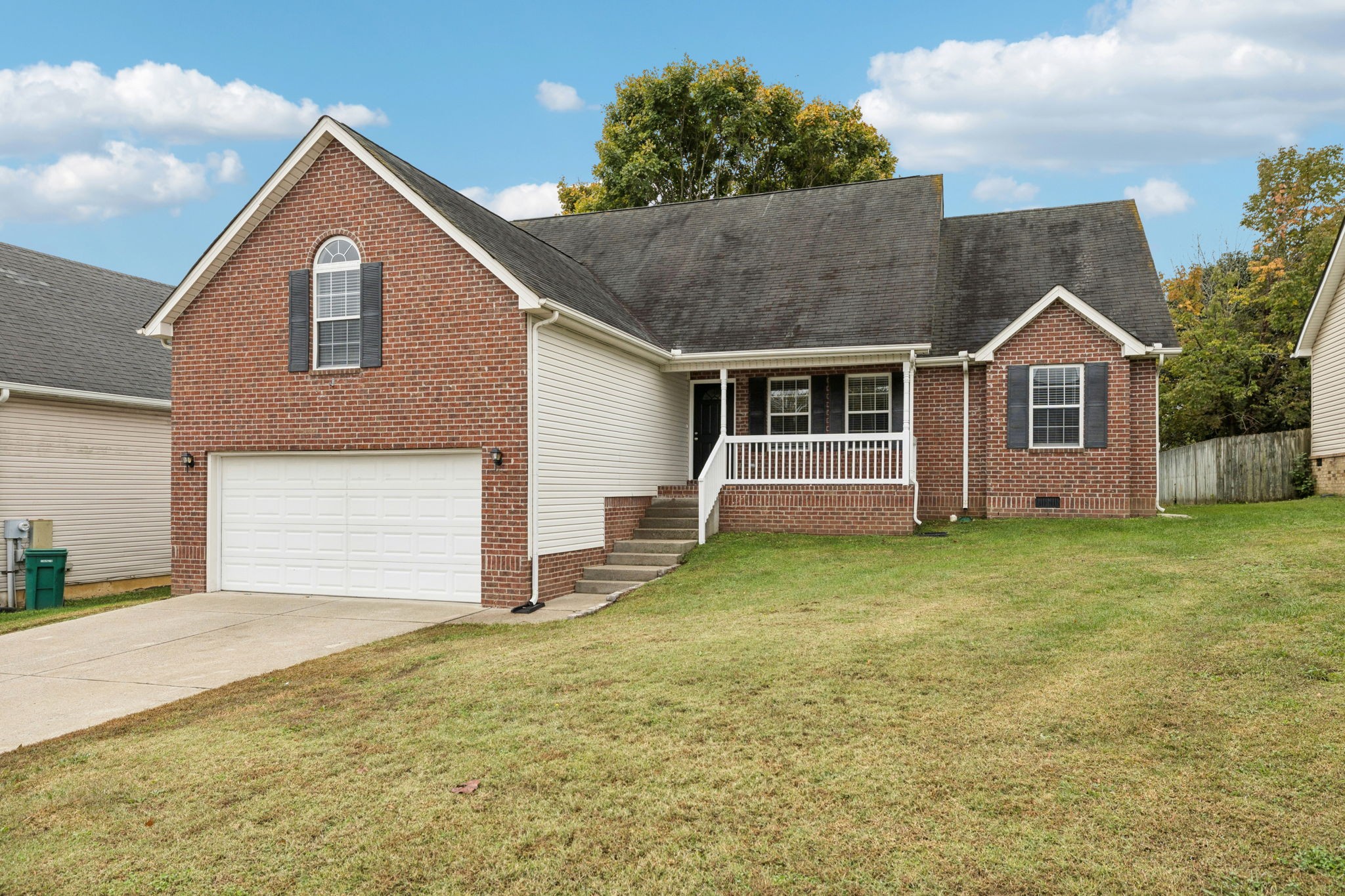 1305 Chapman Court Spring Hill, TN 37174 - Photo 2 of 53 a front view of a house with a garden and yard