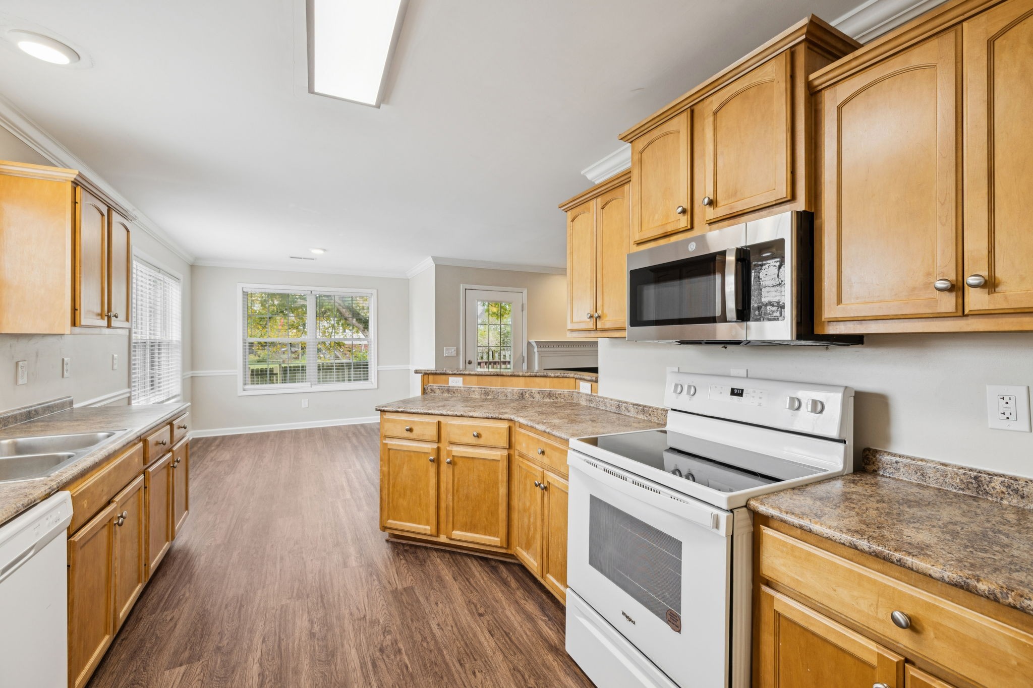 1305 Chapman Court Spring Hill, TN 37174 - Photo 24 of 53 a kitchen with stainless steel appliances a stove a sink and a microwave
