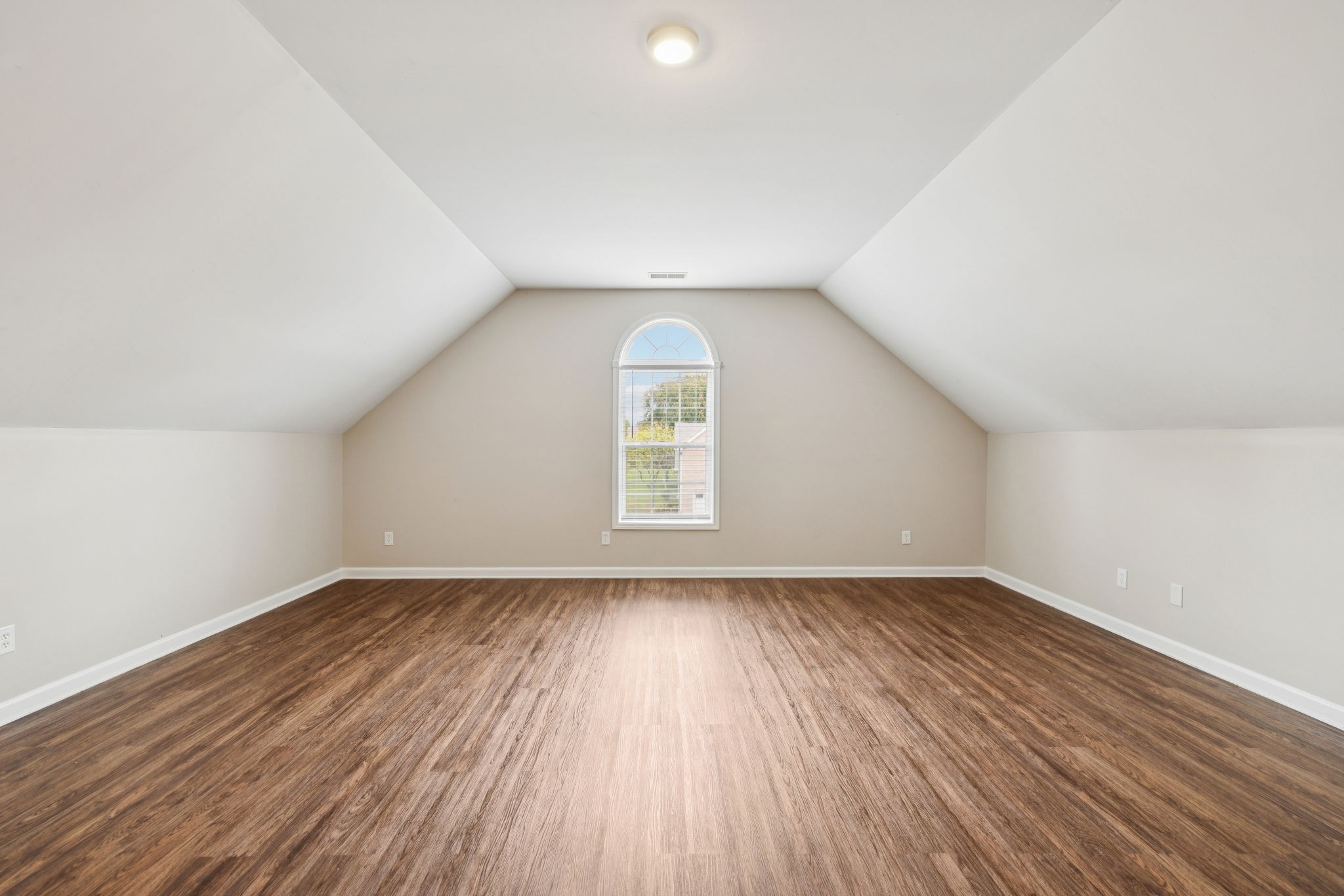 1305 Chapman Court Spring Hill, TN 37174 - Photo 27 of 53 an empty room with wooden floor cabinet and windows