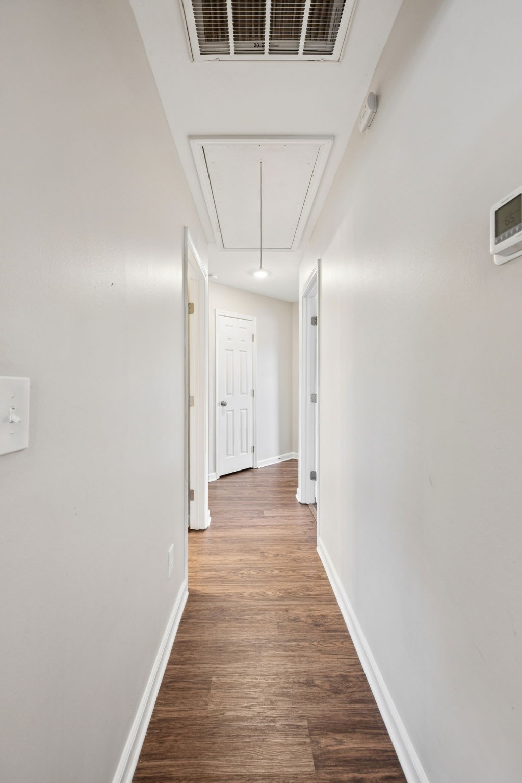 1305 Chapman Court Spring Hill, TN 37174 - Photo 31 of 53 a view of a hallway with wooden floor
